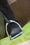 Dressage rider and horse closeup boot in stirrup detail