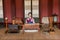 Dressed mannequin of a maid in an imperial palace reading books at Hwaseong Haenggung Palace, the ornate residential palace built