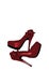 Dressed shoes on the platform with a bow on a high thin heel. Shoes. Red