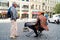 dressed up street musician with horse head and keyboard in Prague