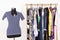 Dressing closet with colorful clothes arranged on hangers and an