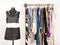 Dressing closet with colorful clothes arranged on hangers and an