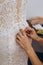 A dressmaker sews a dress for a wedding