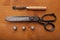 Dressmaker shears craft concept with polw and thimble on wooden