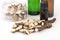 Dried Acorus calamus roots, also known as sweet flag, and bottles with oil and extract isolated on light background. Close up