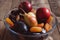 Dried apricots and dates plate, plum, apple, pear in a plate, closeup shot