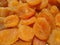 Dried apricots orange background