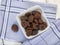 Dried apricots without sulfur in bowl on table, high angle view