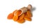 Dried apricots on a wooden scoop, dried fruit, close-up isolated on a white background.