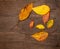 Dried autumn leaves placed on wooden plate