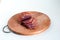 Dried beef. Sliced beef jerky. Meat on a wooden board.