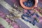 Dried blue berries on colorful ethnic carpet and clay pot.