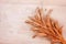 Dried bread spikes on a wooden table. Autumn harvest of bread