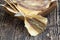 dried and butchered small fish on a wooden table