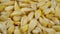 Dried cancha maize kernels close up. Dry corn seeds. Macro.