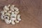 Dried cashew nuts on a wooden table