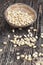 dried cedar nuts on a wooden table