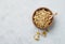 Dried chamomile in a wooden bowl. Healthy food and drink concept. Herbal and alternative medicine with dry herbs