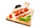 Dried cherry tomatoes with bacon served on carving board. Select