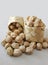 Dried chickpea legume in baskets on white background