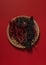 Dried Chilis on wood dish Red background Pasilla and Guajillo mexican spice