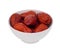 Dried chinese jujube or red date in the white bowl isolated