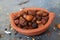 Dried coccinia grandis in the red clay pot. it is also know as Mithuku Vathal