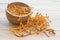 Dried cordyceps militaris on wooden background.