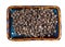 Dried cubeb pepper on rectangular plate cutout