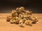 Dried daisy on the cutting board with black background