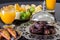 Dried date palm fruits, fresh orange juice, samosa snack and blurred fruit