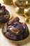 Dried date palm fruits or kurma, ramadan food which eaten in fasting month. Pile of fresh dried date fruits in golden metal bowl.