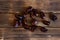 Dried dates lie on a wooden table. View from above