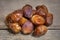 Dried dates on wooden table, sort bawalini, sweet vegan superfruit