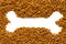 Dried dog food  background. Top view grain pet food banner background with shape of bone copy space of text design. Above or Top