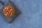 Dried fava bean in wooden bowl. Top view with copy space