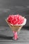 Dried flowers bouquet.Lagurus pink Bouquet on an old rustic table on a gray wall background