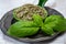 Dried and fresh leaves of green aromatic basil plant used for cooking and medicine