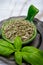 Dried and fresh leaves of green aromatic basil plant used for cooking and medicine