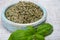 Dried and fresh leaves of green aromatic basil plant used for cooking and medicine