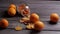 Dried and fresh oranges on a wooden background.