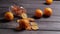 Dried and fresh oranges on a wooden background.