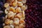 Dried fruit background. Rows of dried dates, apricots,cranberries, nuts, prunes
