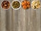 Dried fruit in a wooden bowls. Raisins, dates, dried apricots, figs on a wooden background.