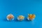 Dried fruits in assortment  in glass cups on a blue background. The concept of a healthy lifestyle