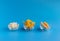 Dried fruits in assortment  in glass cups on a blue background. The concept of a healthy lifestyle