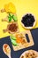 Dried fruits on a colored background Flat lay. mango, raisins, papaya, bananas, dried apricots. Healthy vegetarian food. vertical