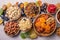 Dried fruits and nuts mix in a wooden bowl. Assortment of candied fruits. Judaic holiday Tu Bishvat. Copy space