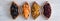 Dried fruits in a wooden bowls on the table. Butterfly shape.