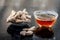 Dried ginger with honey on wooden surface.